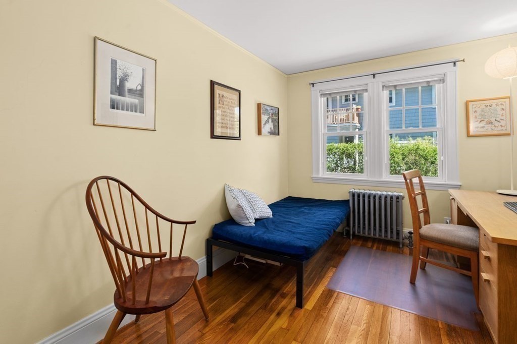 18 Stoneleigh Road, Unit 18 Newton, MA 02465 - Photo 11 of 26 a living room with furniture and a window