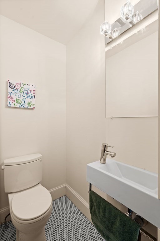 18 Stoneleigh Road, Unit 18 Newton, MA 02465 - Photo 24 of 26 a bathroom with a toilet and a sink