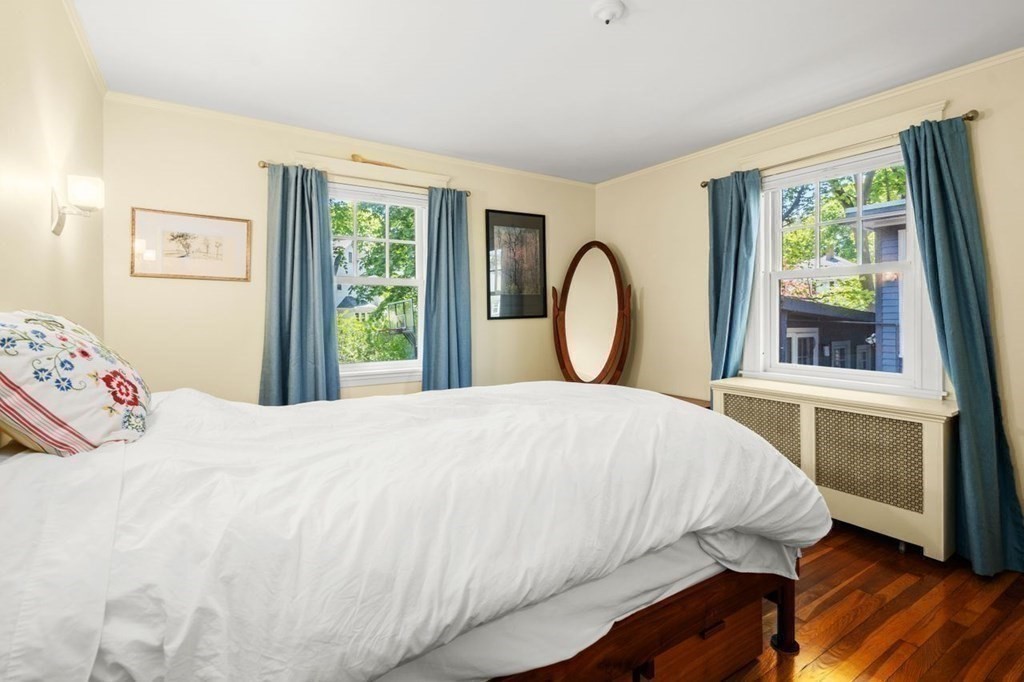 18 Stoneleigh Road, Unit 18 Newton, MA 02465 - Photo 7 of 26 a bedroom with a bed and a large window