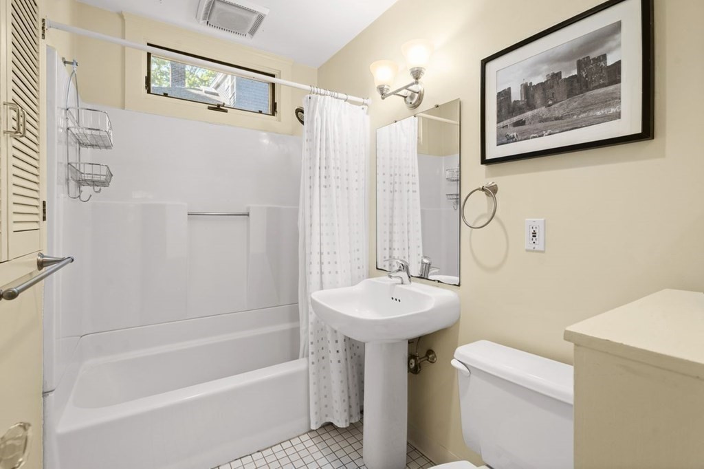 18 Stoneleigh Road, Unit 18 Newton, MA 02465 - Photo 9 of 26 a bathroom with a sink a toilet and shower
