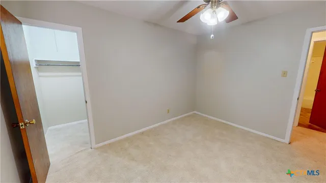 an empty room with a hallway