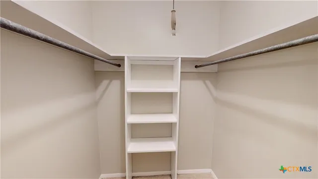 a view of an empty walk in closet