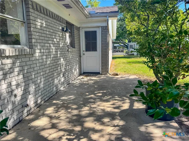 a view of a back yard of the house
