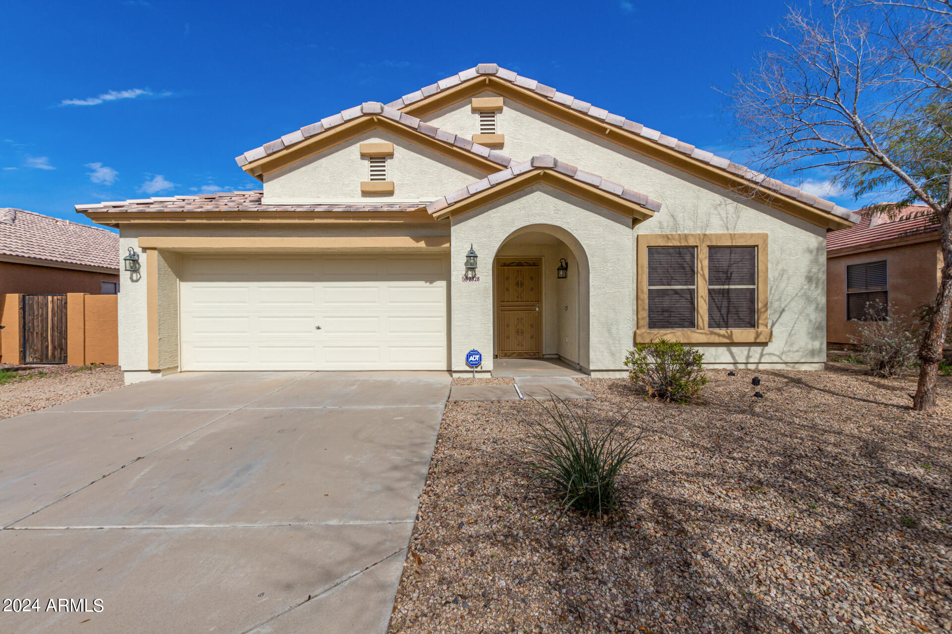2328 West Carson Road Phoenix, AZ 85041 - Photo 1 of 42 a front view of a house with a yard and garage