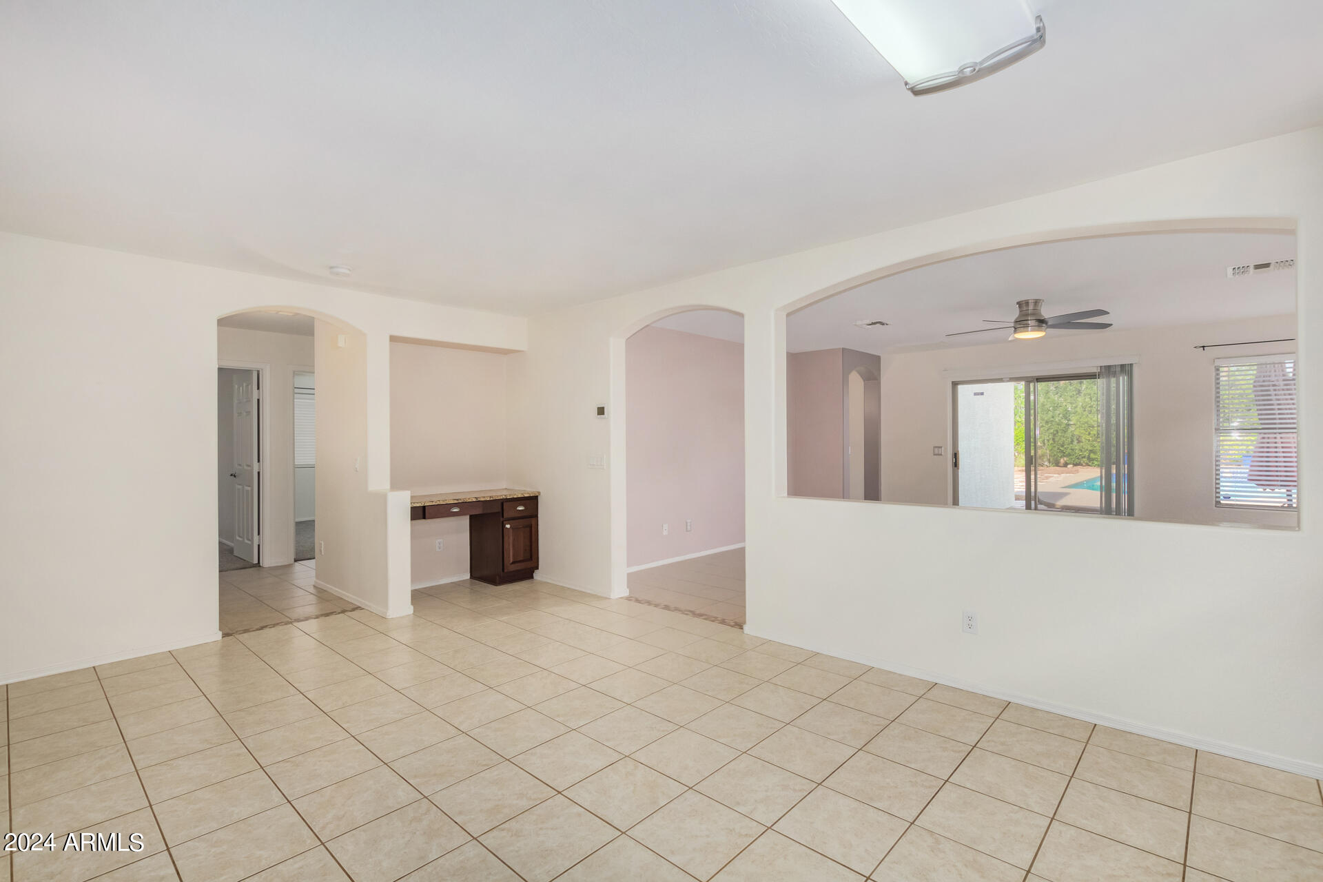 2328 West Carson Road Phoenix, AZ 85041 - Photo 12 of 42 an empty room with windows