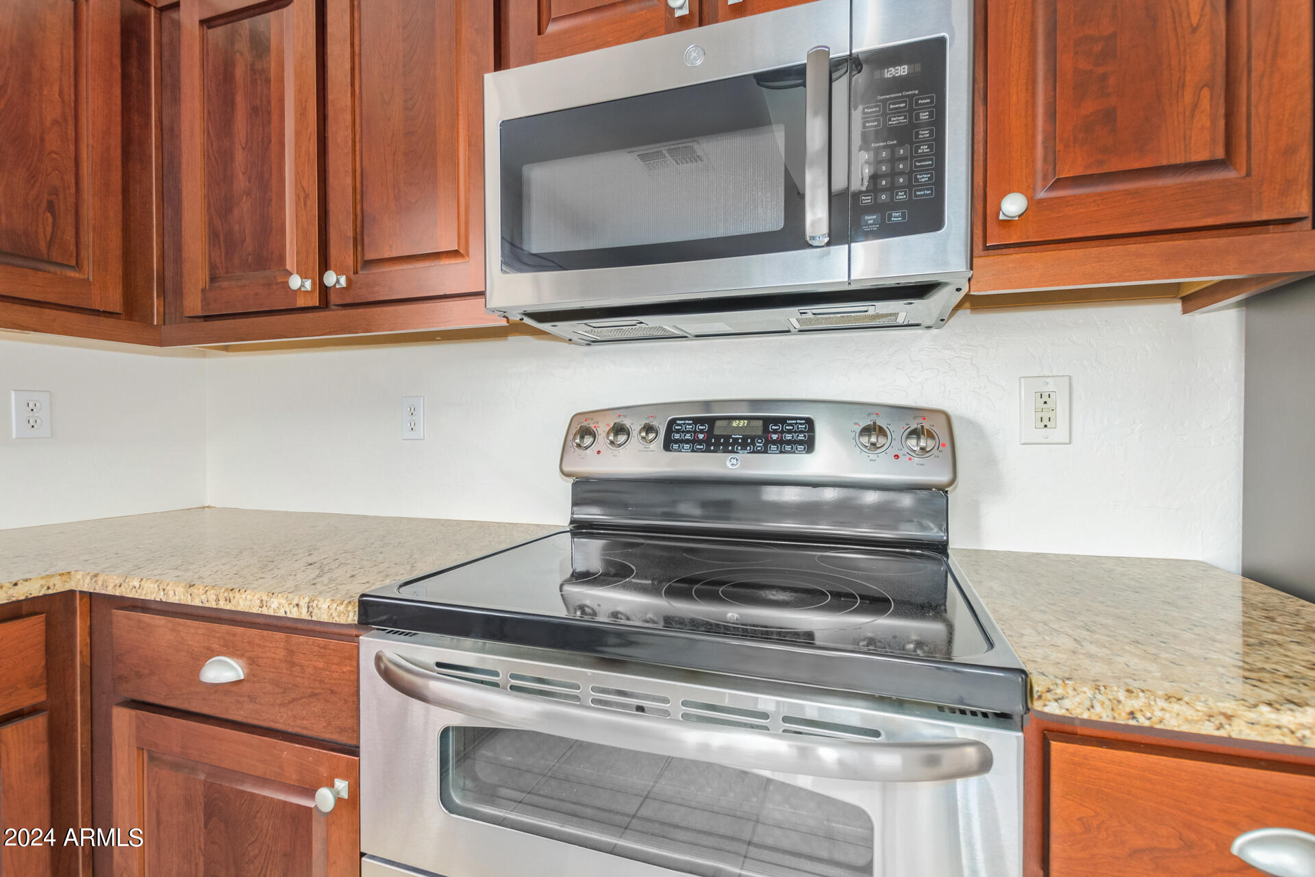 2328 West Carson Road Phoenix, AZ 85041 - Photo 18 of 42 a stove top oven sitting inside of a kitchen