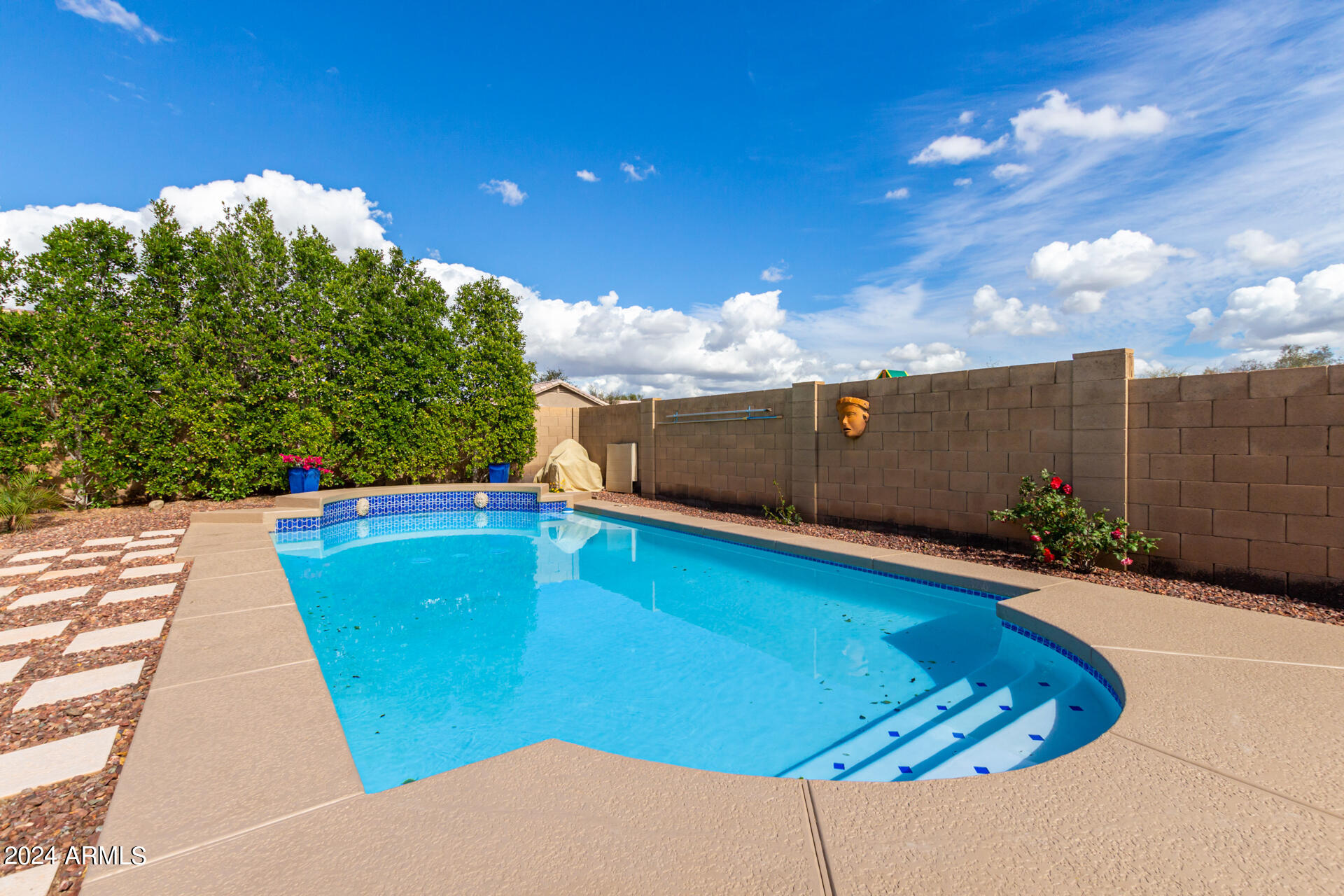 2328 West Carson Road Phoenix, AZ 85041 - Photo 38 of 42 a view of a swimming pool with an outdoor space and seating area