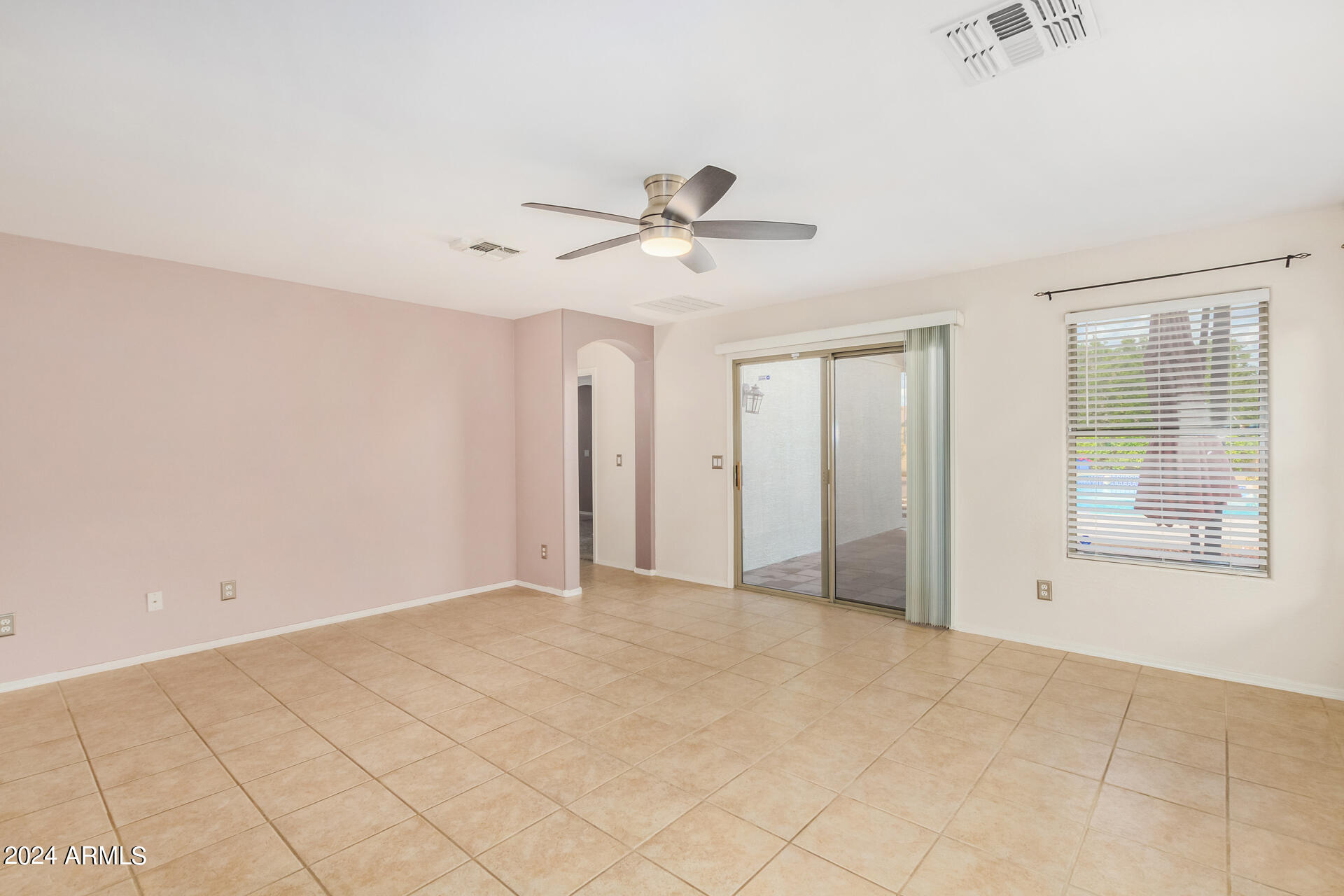 2328 West Carson Road Phoenix, AZ 85041 - Photo 8 of 42 a view of an empty room with a window