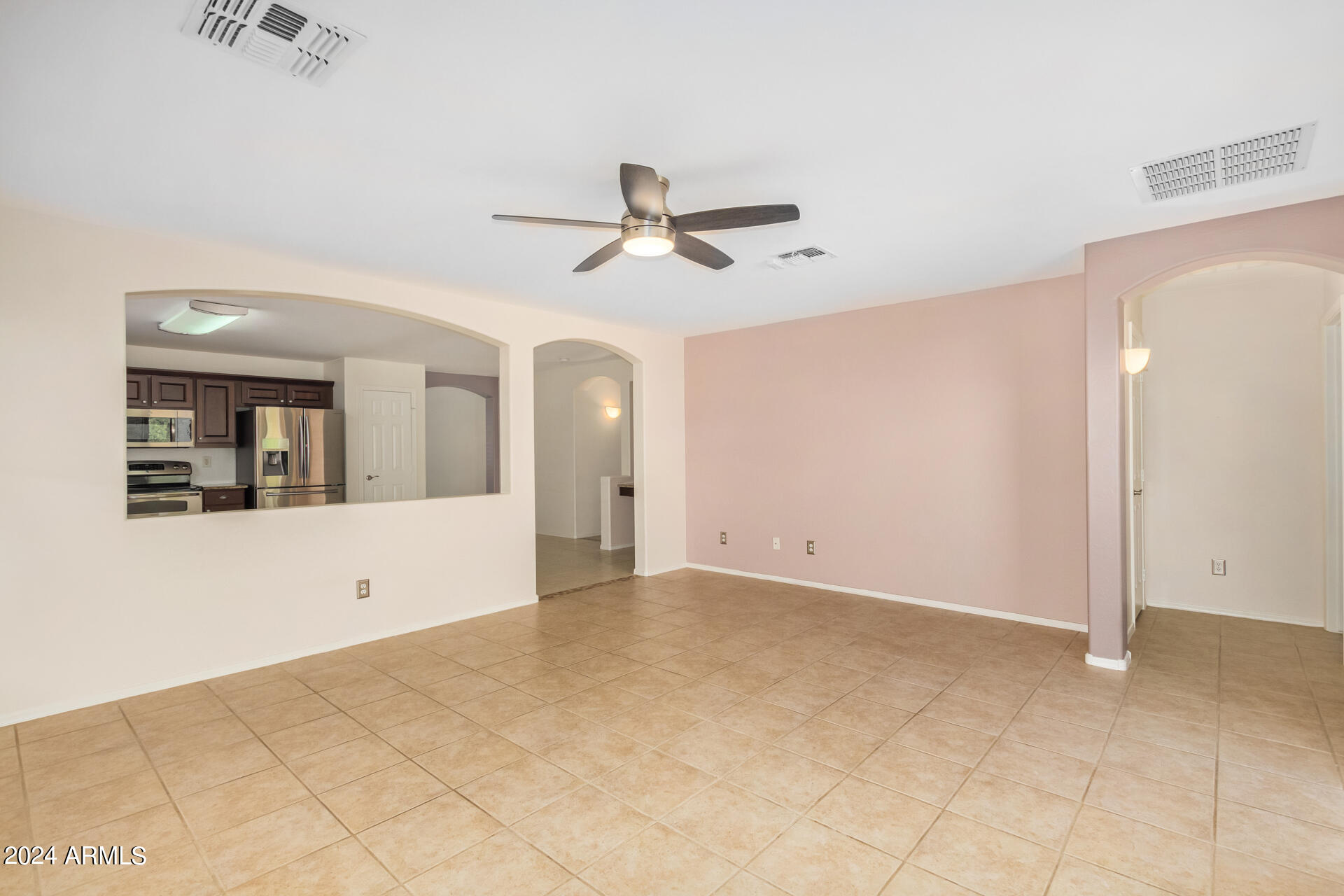2328 West Carson Road Phoenix, AZ 85041 - Photo 10 of 42 a view of a big room with carpet