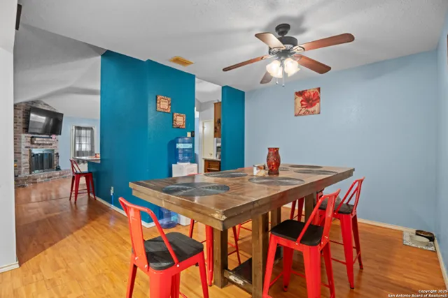 a view of a dining room with furniture and wooden floor