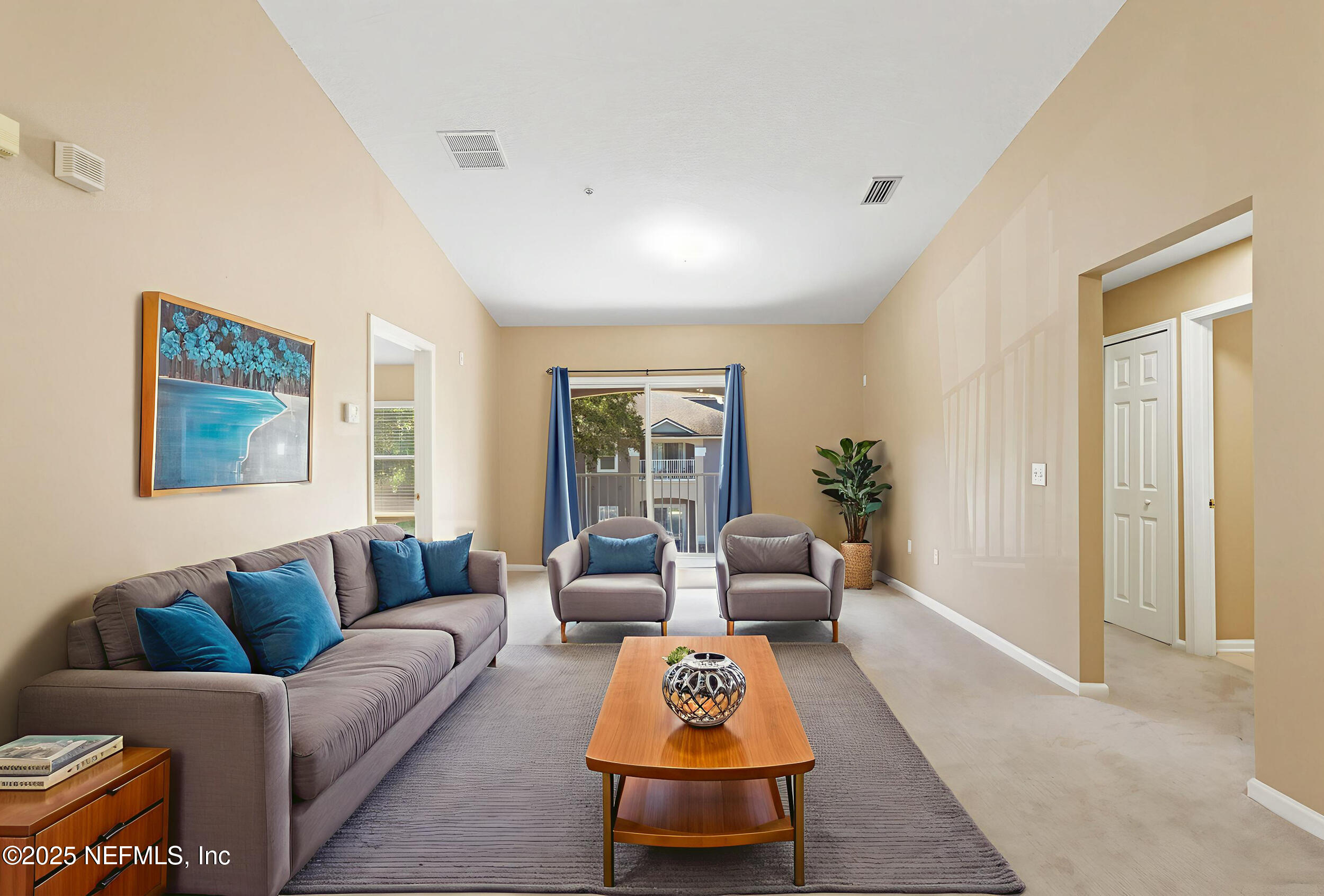 6069 Maggies Circle, Unit 115 Jacksonville, FL 32244 - Photo 18 of 36 a living room with furniture and a rug