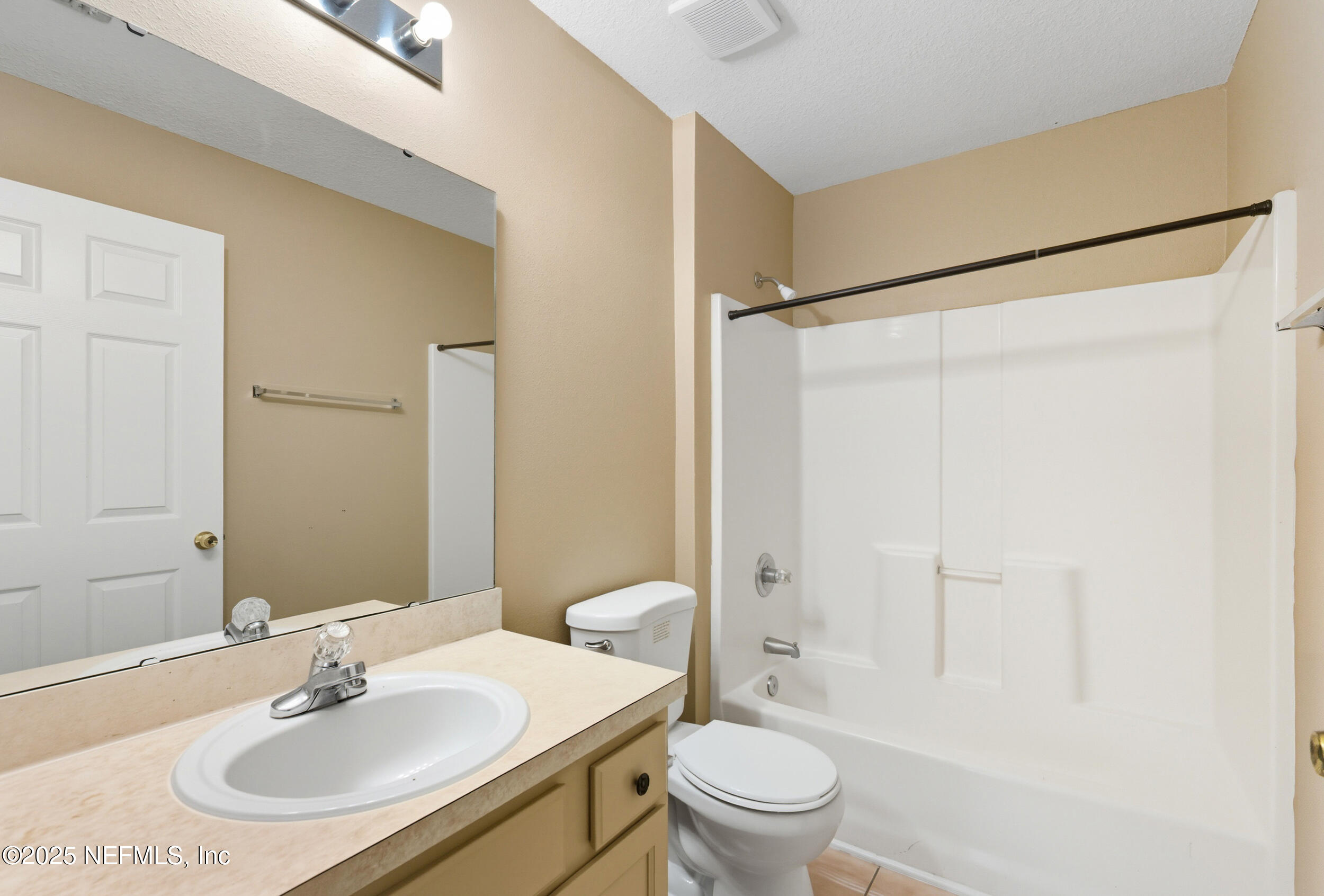 6069 Maggies Circle, Unit 115 Jacksonville, FL 32244 - Photo 22 of 36 a bathroom with a sink toilet and shower