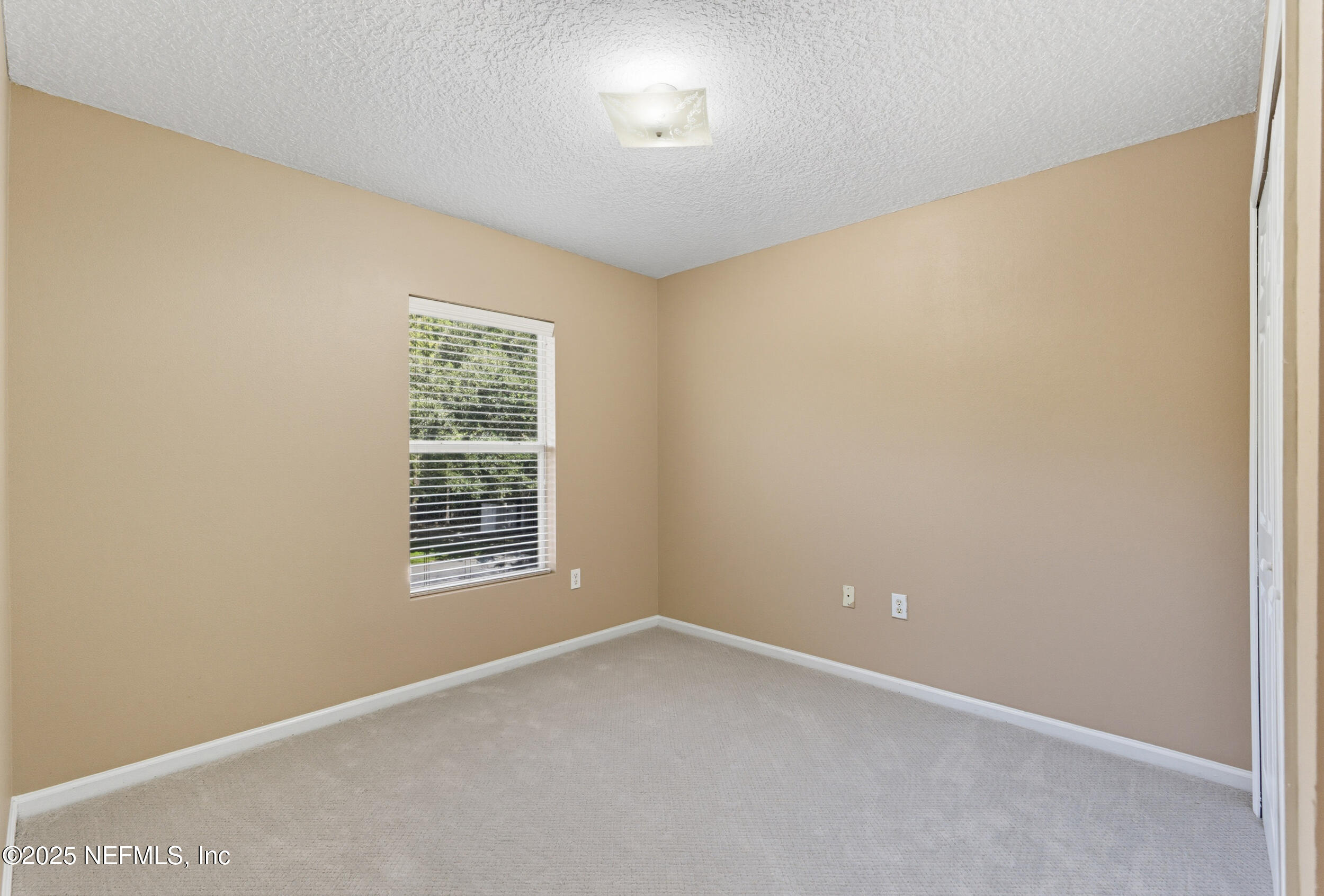 6069 Maggies Circle, Unit 115 Jacksonville, FL 32244 - Photo 23 of 36 an empty room with a window