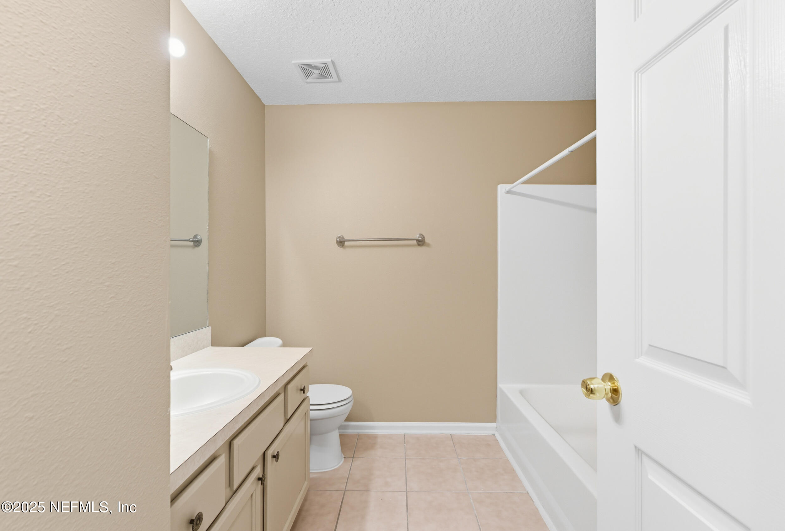 6069 Maggies Circle, Unit 115 Jacksonville, FL 32244 - Photo 25 of 36 a bathroom with a sink a toilet and shower