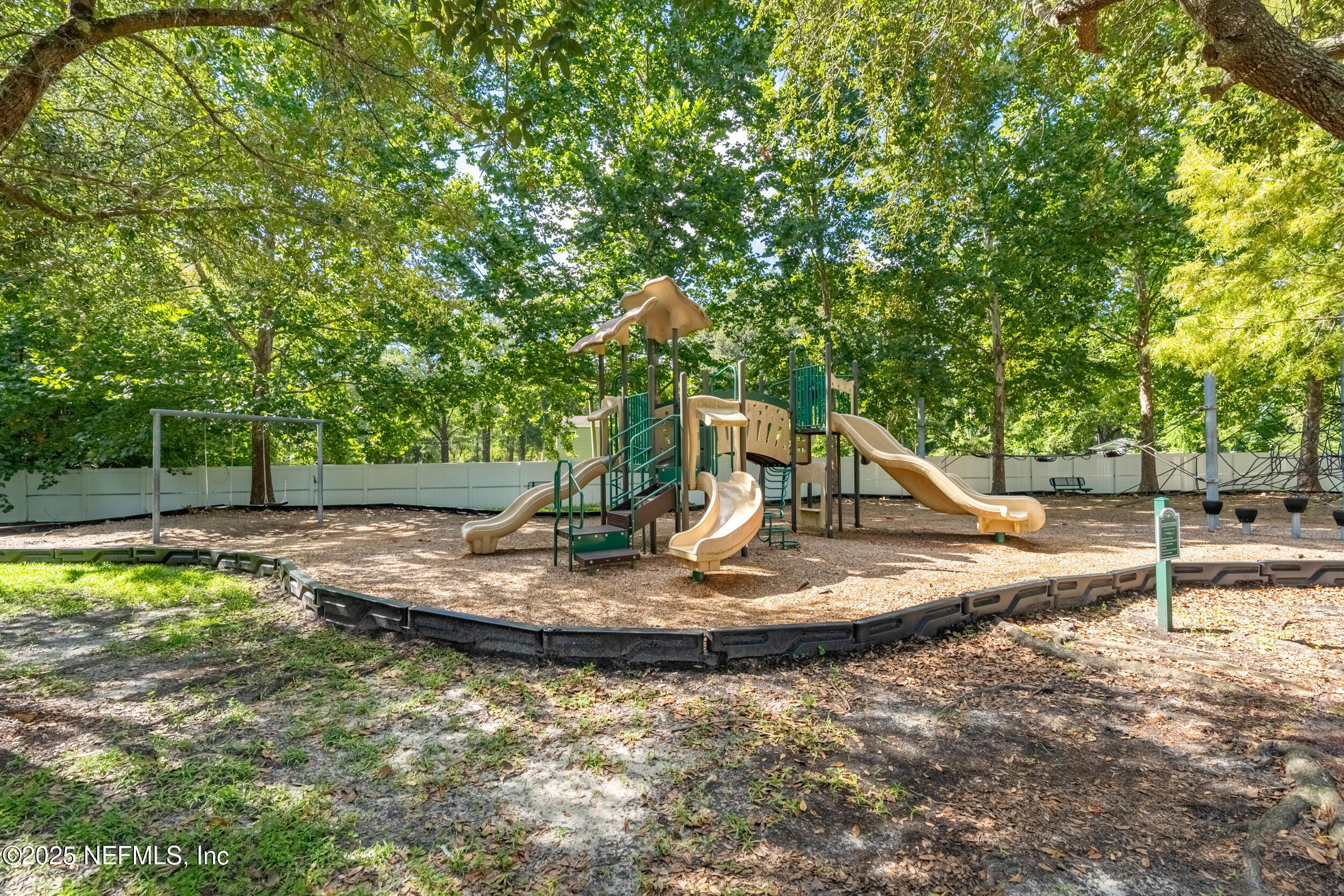 6069 Maggies Circle, Unit 115 Jacksonville, FL 32244 - Photo 33 of 36 a view of a playground with a slide