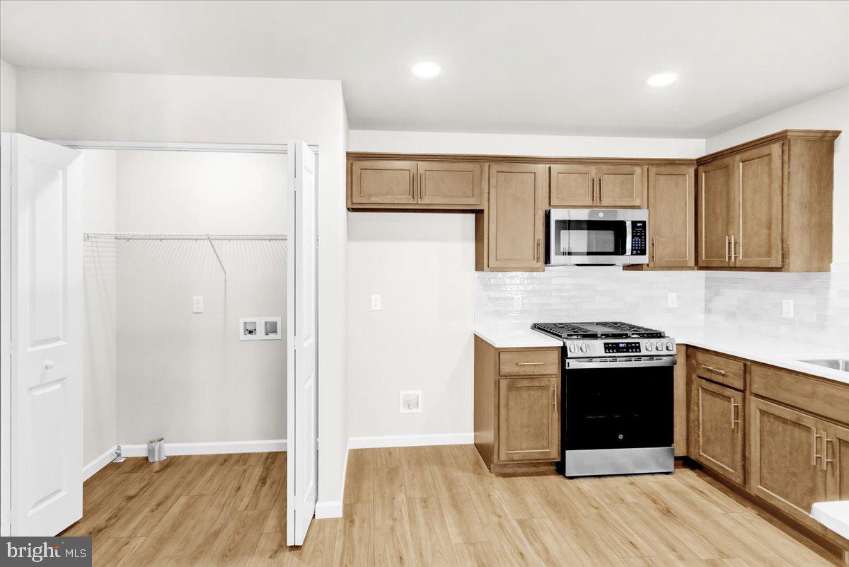 2450 Jefferson Avenue Reading, PA 19609 - Photo 11 of 33 a kitchen with a stove and a refrigerator