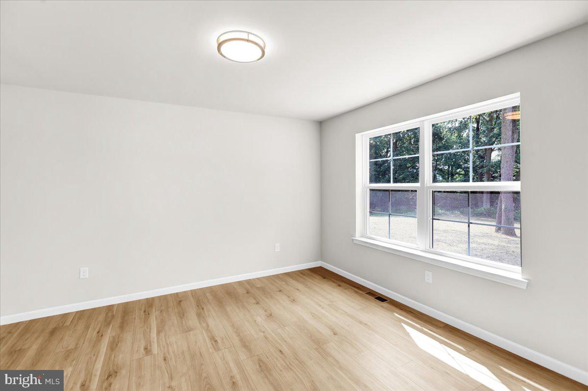 2450 Jefferson Avenue Reading, PA 19609 - Photo 15 of 33 an empty room with wooden floor and windows