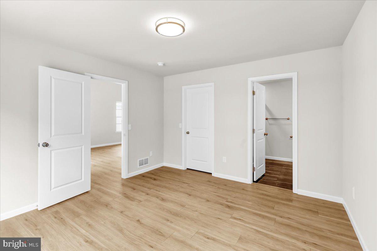 2450 Jefferson Avenue Reading, PA 19609 - Photo 16 of 33 an empty room with wooden floor and windows