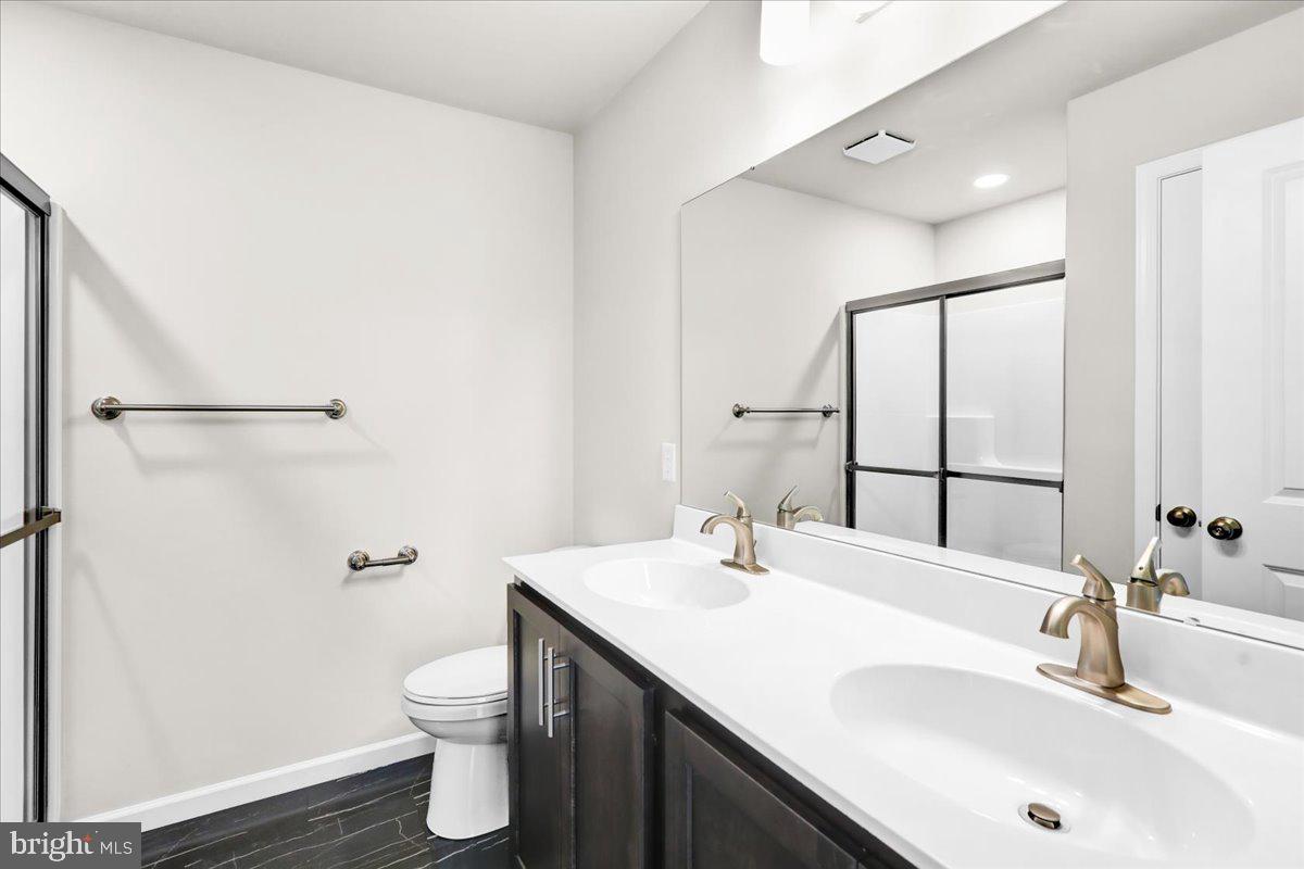2450 Jefferson Avenue Reading, PA 19609 - Photo 17 of 33 a bathroom with a sink toilet and shower