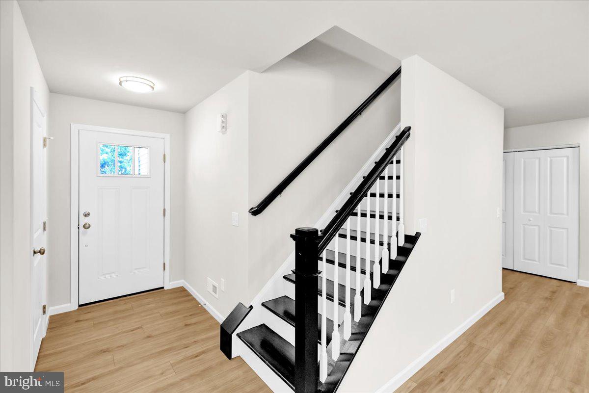 2450 Jefferson Avenue Reading, PA 19609 - Photo 2 of 33 a view of a hallway with wooden floor and staircase