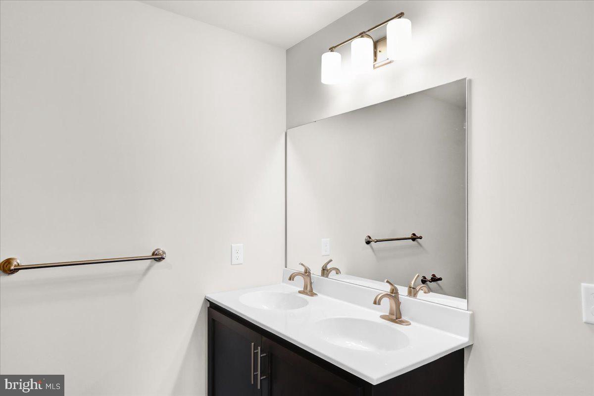 2450 Jefferson Avenue Reading, PA 19609 - Photo 21 of 33 a bathroom with a sink and a mirror