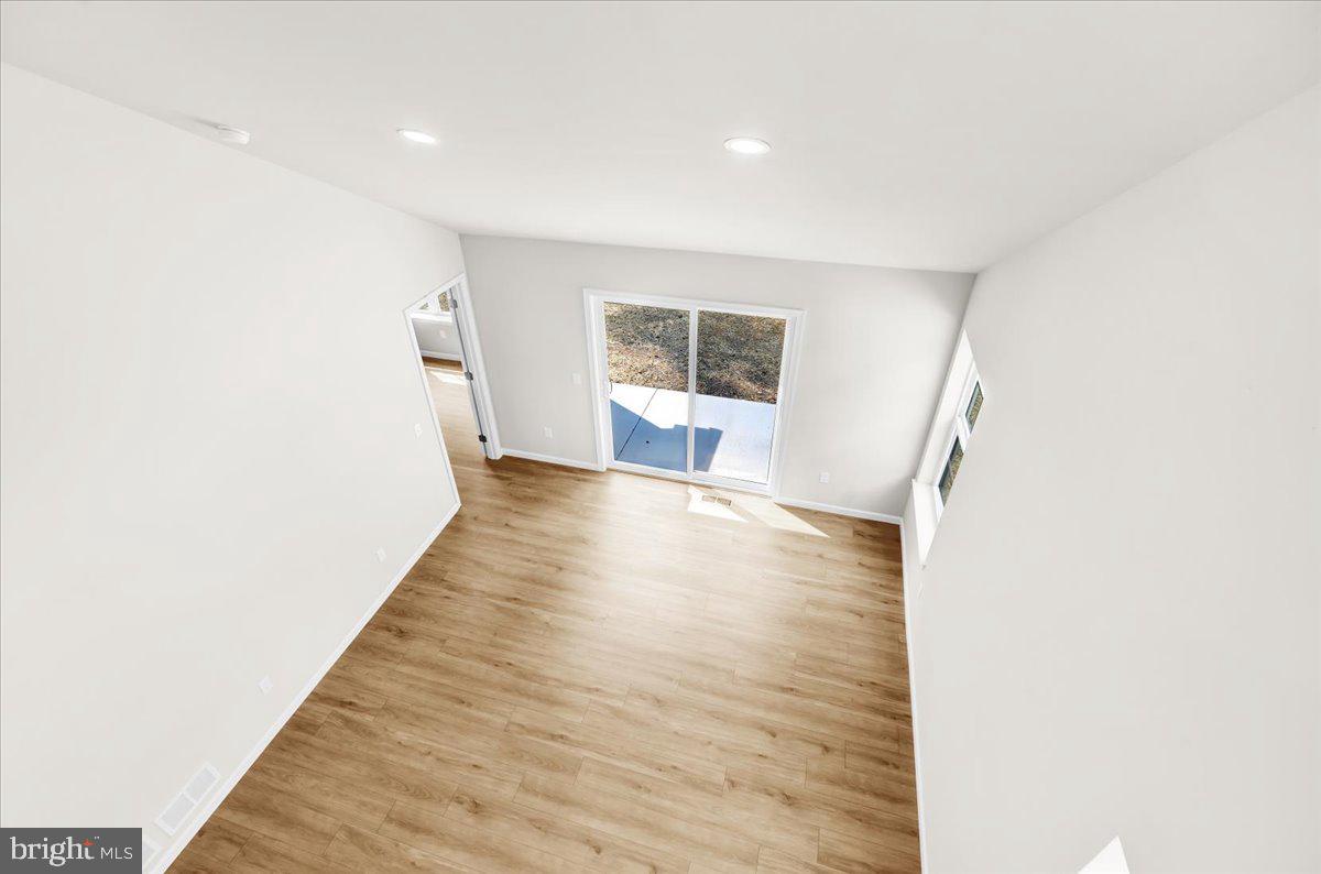 2450 Jefferson Avenue Reading, PA 19609 - Photo 23 of 33 a view of a big room with wooden floor and windows