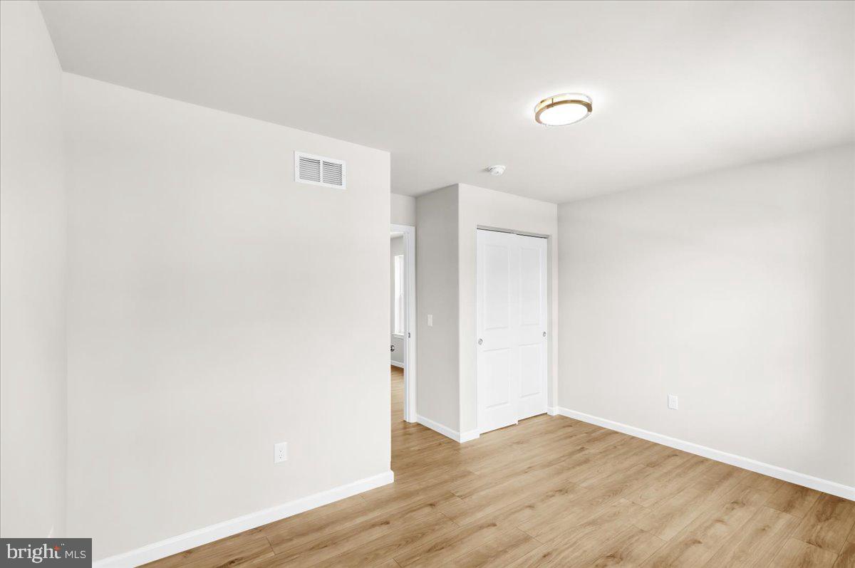 2450 Jefferson Avenue Reading, PA 19609 - Photo 26 of 33 a view of an empty room with wooden floor
