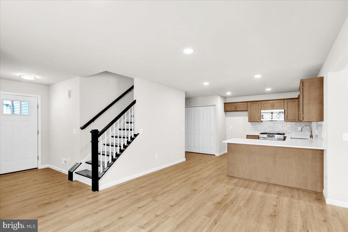 2450 Jefferson Avenue Reading, PA 19609 - Photo 3 of 33 a view of a kitchen with wooden floor and electronic appliances