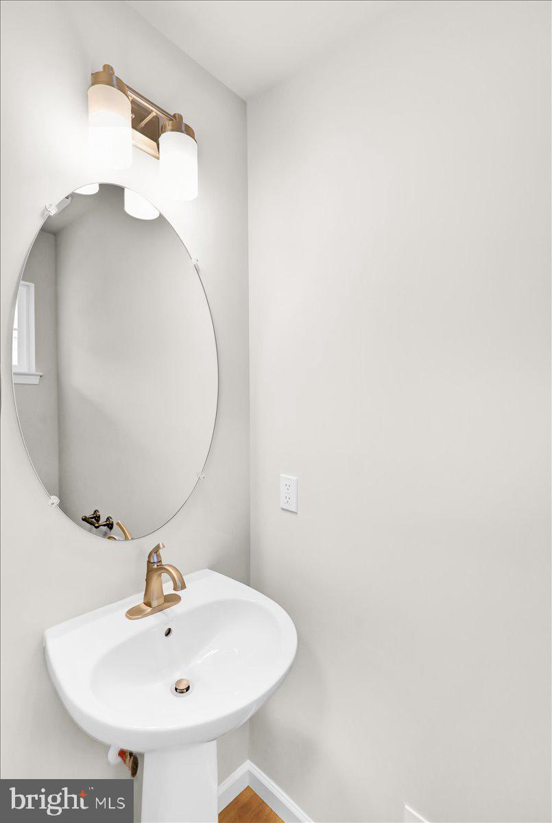 2450 Jefferson Avenue Reading, PA 19609 - Photo 6 of 33 a bathroom with a sink and mirror