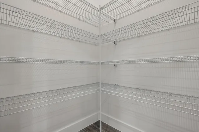 a view of a room with racks on the wall