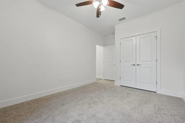 a bathroom with a sink a toilet and vanity