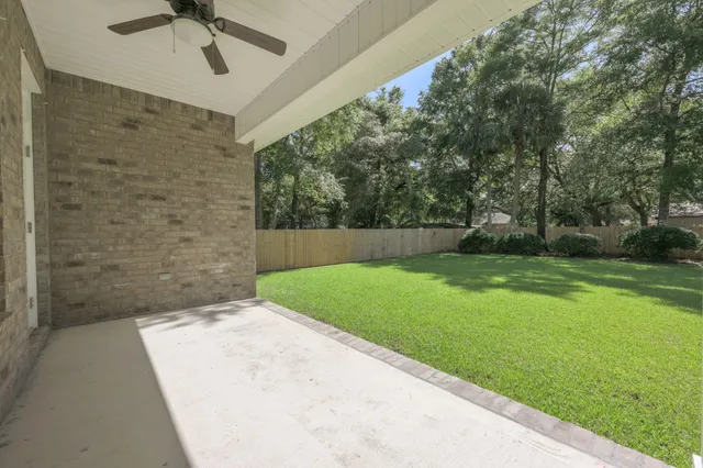 a view of a house with a yard and a porch