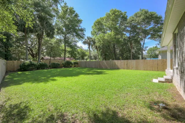 a view of a backyard with a small cabin