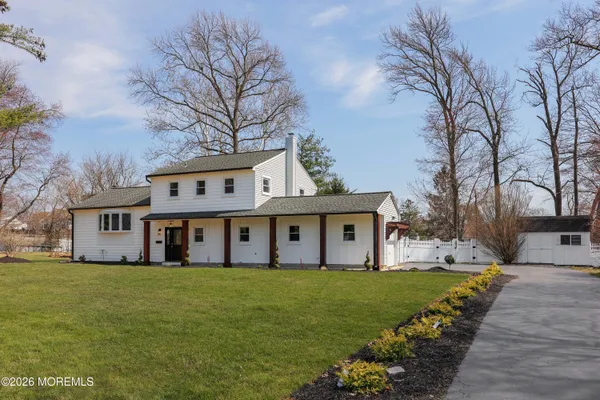 a front view of house with yard and green space