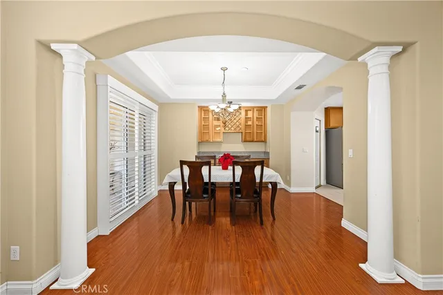 a view of a dining room with furniture window and wooden floor