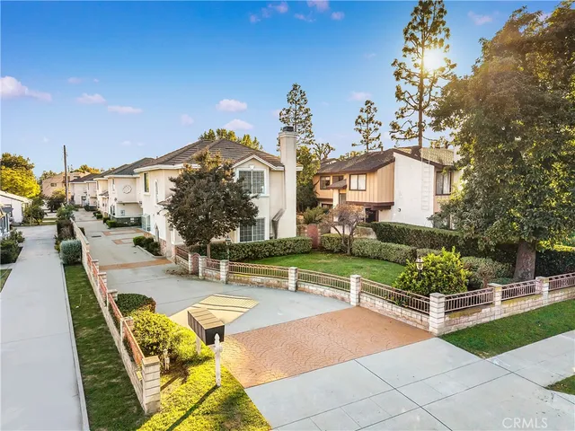 a view of a house with swimming pool and sitting area