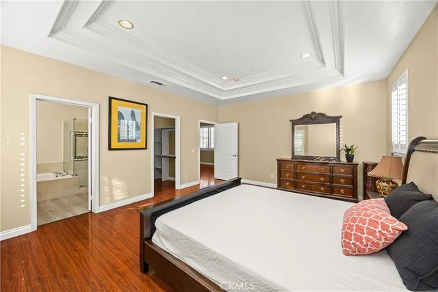 a view of hallway with stairs and wooden floor