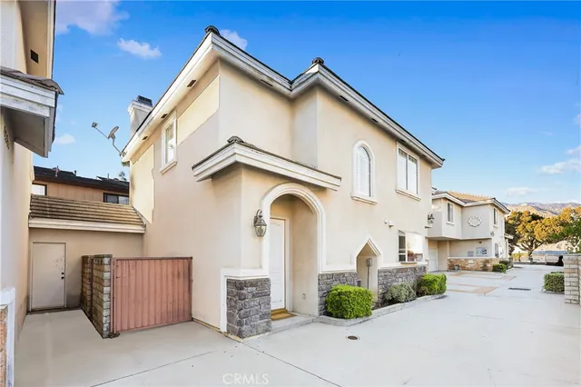 a view of multiple houses with a street