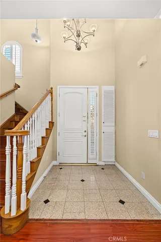 a view of an entryway with wooden floor
