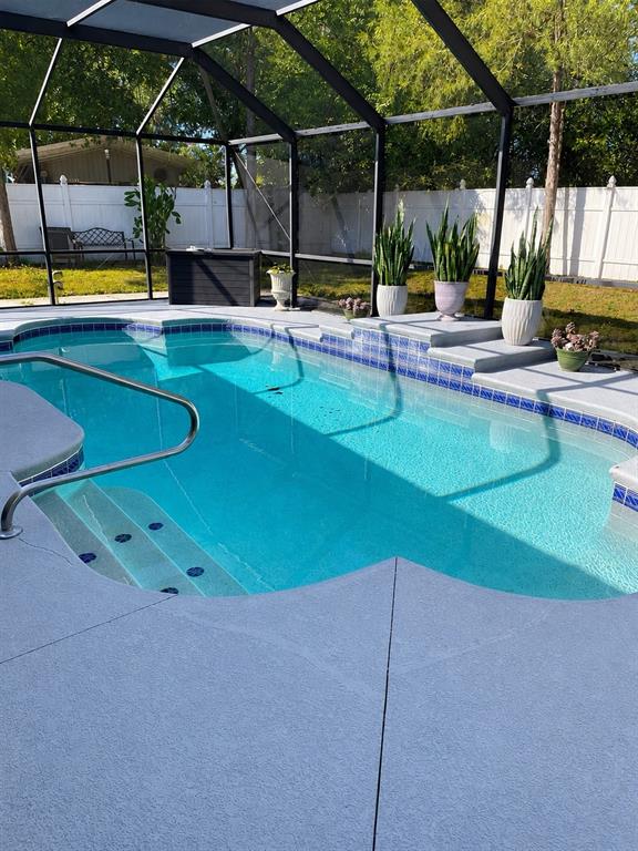 490 Water Road Ocala, FL 34472 - Photo 3 of 12 a view of a swimming pool with a yard