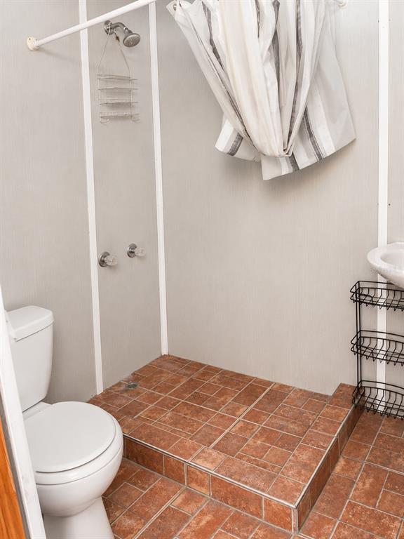 490 Water Road Ocala, FL 34472 - Photo 7 of 12 a bathroom with a toilet and a window