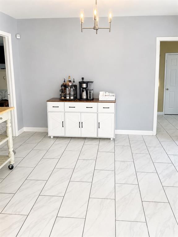490 Water Road Ocala, FL 34472 - Photo 8 of 12 a room with washing machine and cabinets