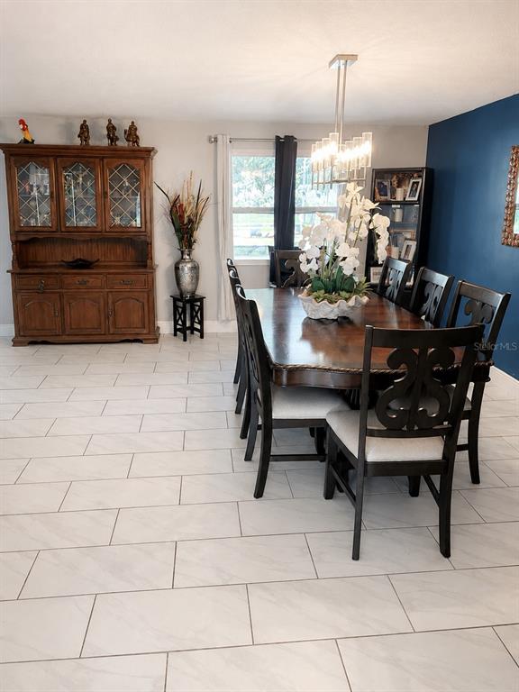 490 Water Road Ocala, FL 34472 - Photo 9 of 12 a view of a dining room with furniture