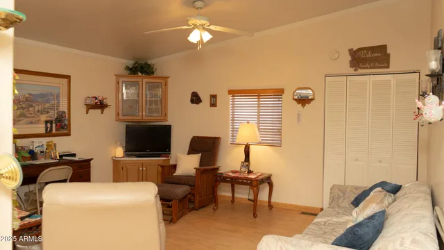 a view of a livingroom with workspace and a couch