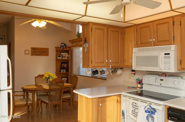 a kitchen with a sink and a refrigerator
