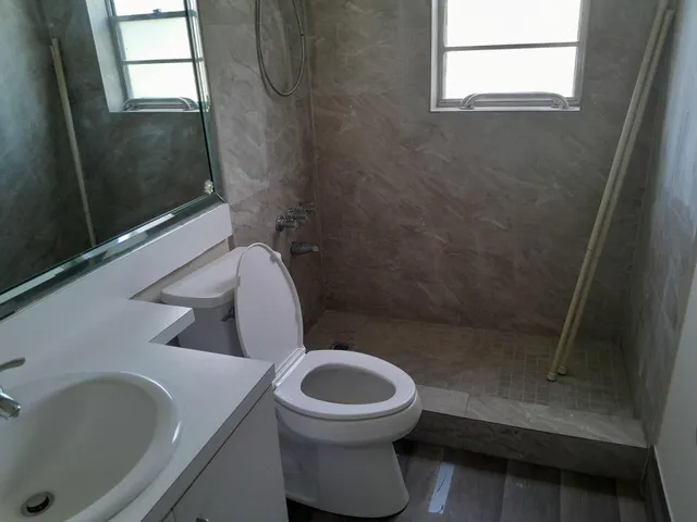 a bathroom with a toilet and a sink