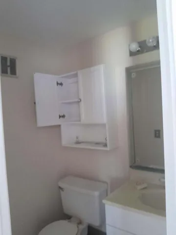 a bathroom with a toilet and a bathtub