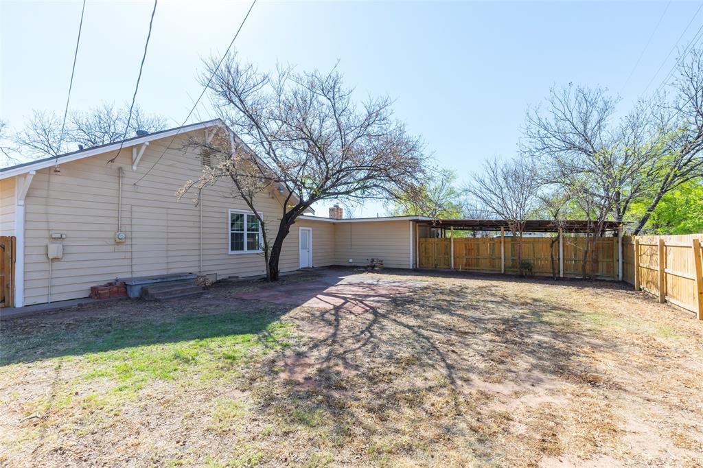 601 North Ave G Haskell, TX 79521 - Photo 34 of 36 a view of a backyard with a large tree