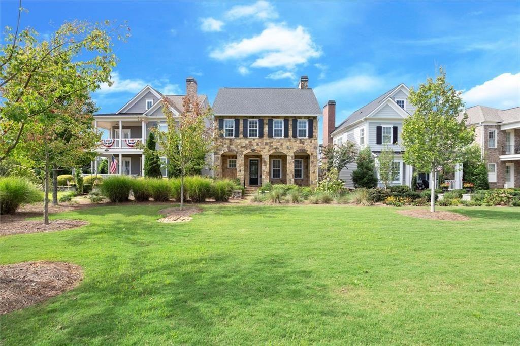 293 Thompson Street Alpharetta, GA 30009 - Photo 1 of 71 a front view of a house with a garden