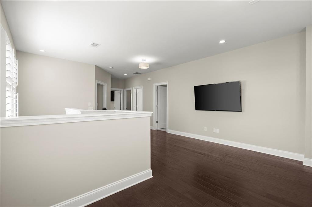 293 Thompson Street Alpharetta, GA 30009 - Photo 31 of 71 a view of a livingroom with wooden floor